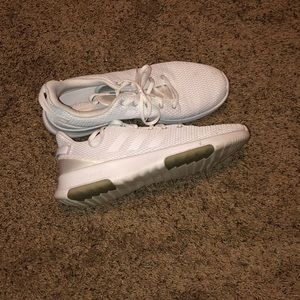 All white adidas running shoes